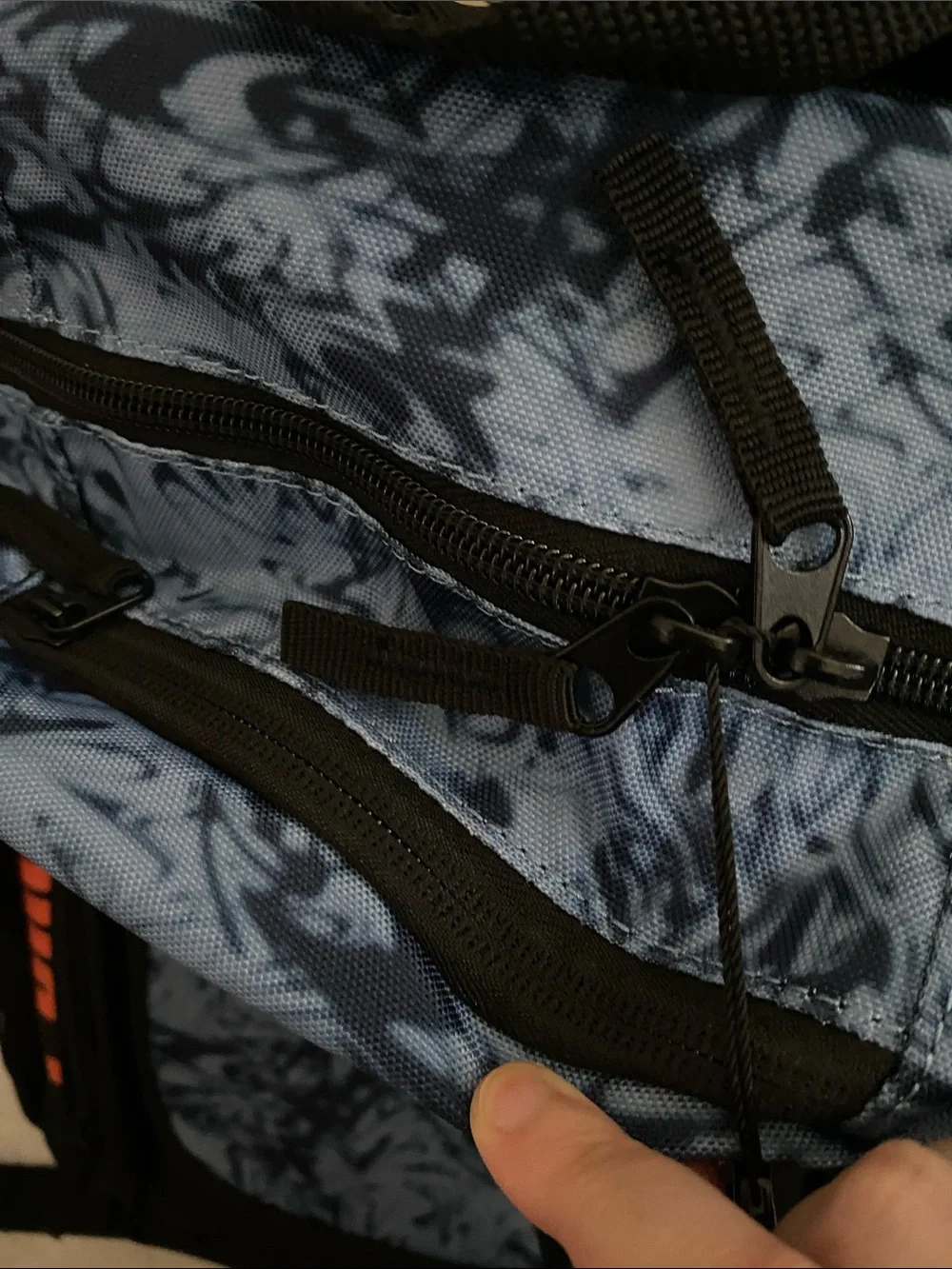 Puma Blue Marble Backpack with Orange Logo and Black Accents